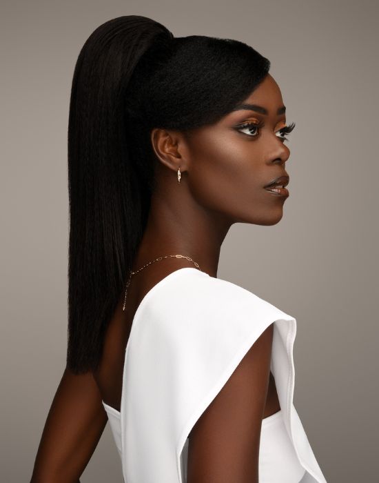 Feme 2-in-1 Human Hair Mia half wig - side view of hair as a ponytail. Long, straight, yaki textured human hair style with a tapered V-cut at the back and layered look at the front.